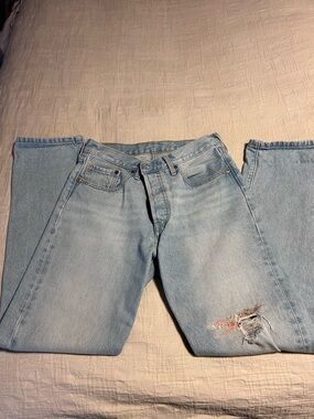 Levi's Light Blue Relaxed Fit Jeans with Knee Distress